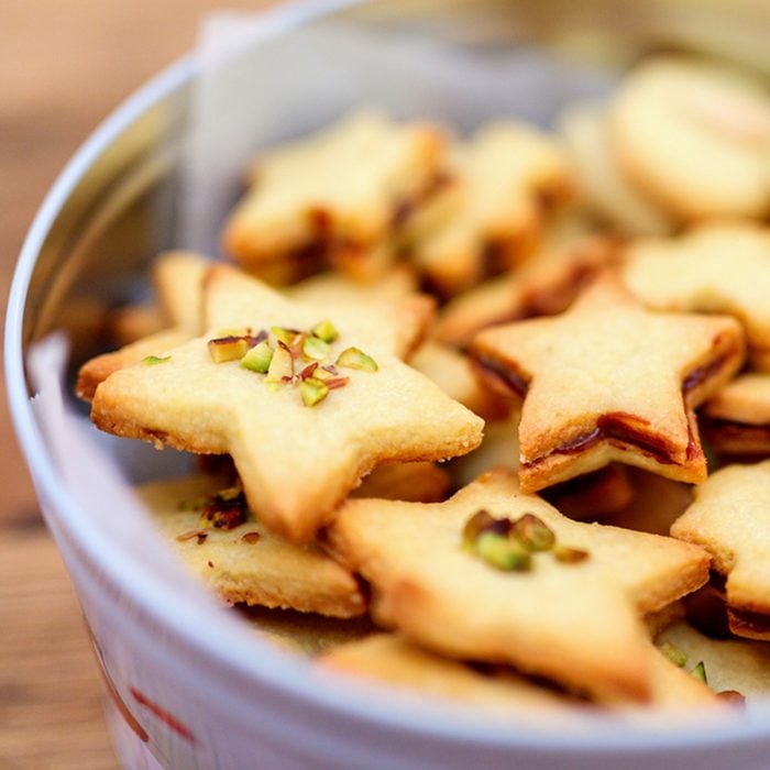 Freshly baked homemade Christmas cookies in a tin box