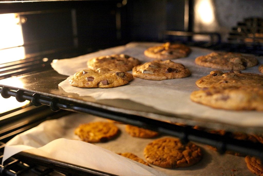 Fresh chocolate chip cookies being baked in an oven; Shutterstock ID 779345518; Job (TFH, TOH, RD, BNB, CWM, CM): Taste of Home
