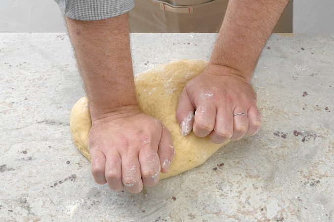 Kneading Dough On Floured Surface