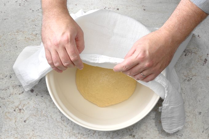 Show Bowl With Dough Ball In Bowl, Towel Half Covering It