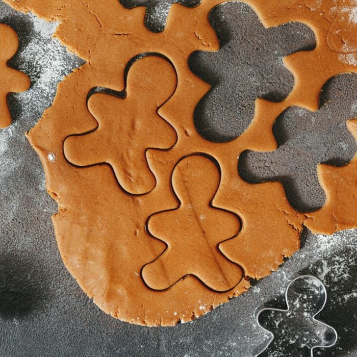 Raw dough for cooking Christmas cookies ginger men top view