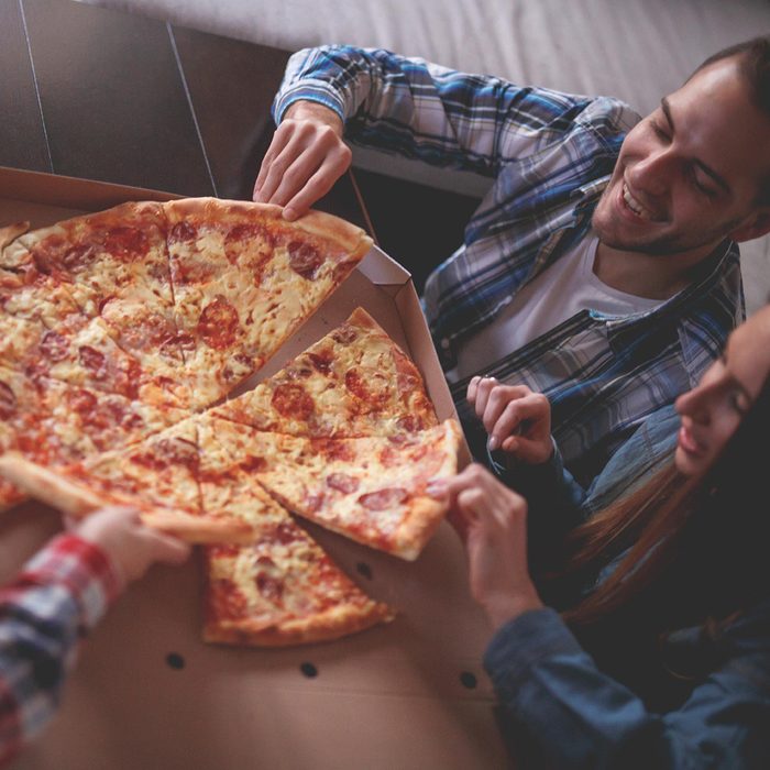 Friends sharing pizza
