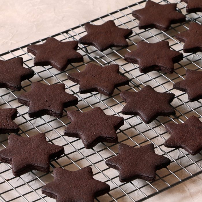 Sugar chocolate cookies on wooden background, top view.