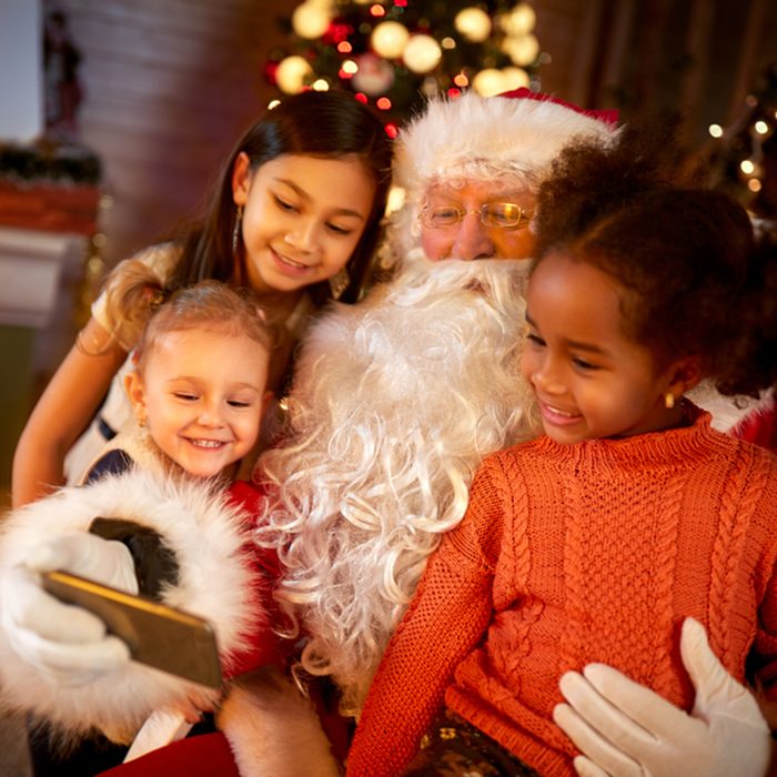 Santa Claus sharing smart phone with children in Christmas atmosphere; Shutterstock ID 514808041; Job (TFH, TOH, RD, BNB, CWM, CM): TOH
