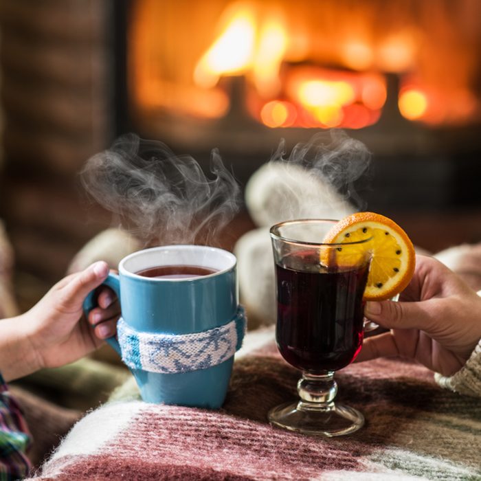 Warming and relaxing near fireplace. 