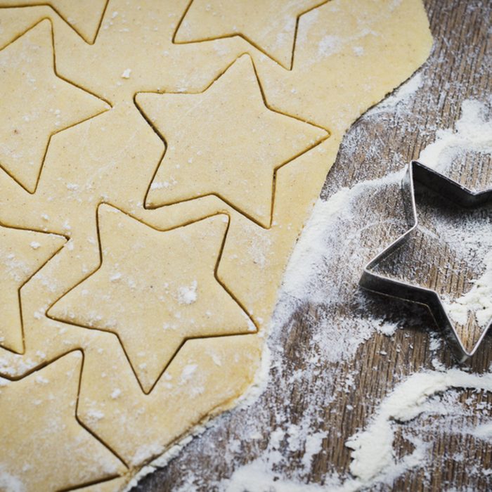 Christmas baking. Making gingerbread biscuits. Cookie dough and cookie cutters on kitchen counter, top view.; Shutterstock ID 1187249365; Job (TFH, TOH, RD, BNB, CWM, CM): Taste of Home