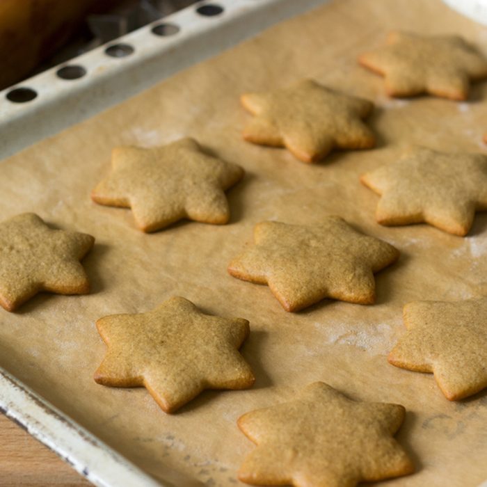 Baked gingerbread on baking sheet without decoration. Selective focus.; Shutterstock ID 777279445; Job (TFH, TOH, RD, BNB, CWM, CM): Taste of Home