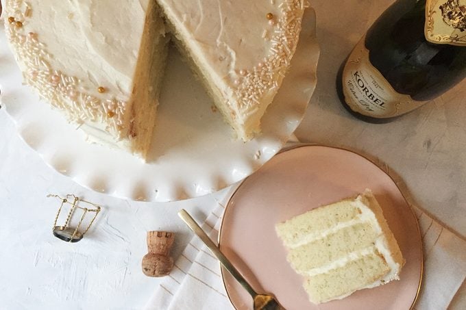 finished champagne cake with one slice missing