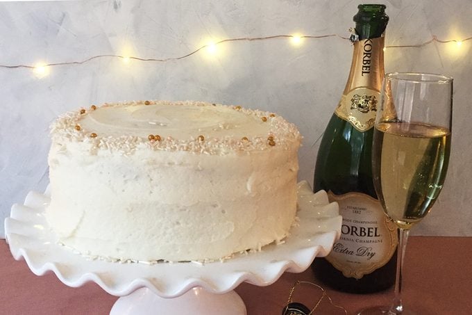 finished champagne cake with bottle of korbel champagne