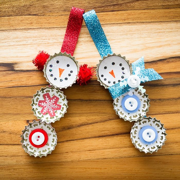 cute hand made recycled christmas ornaments on a wooden table