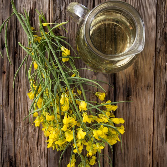 Rape flower on wooden table