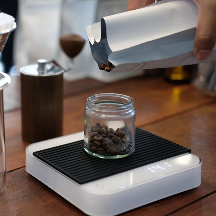 Weighing coffee on a scale