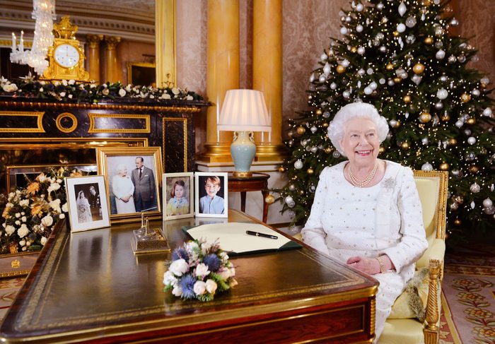 Queen Elizabeth II sits at a desk in the 1844 Room at Buckingham Palace, London, after recording her Christmas Day broadcast to the Commonwealth