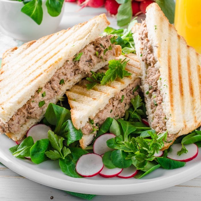 Tuna salad sandwitch with lamb's lettuce and radishes