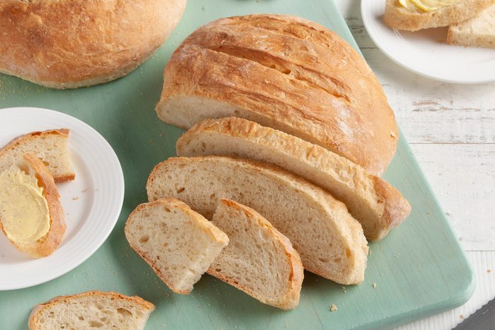 A sliced loaf of homemade sourdough bread.