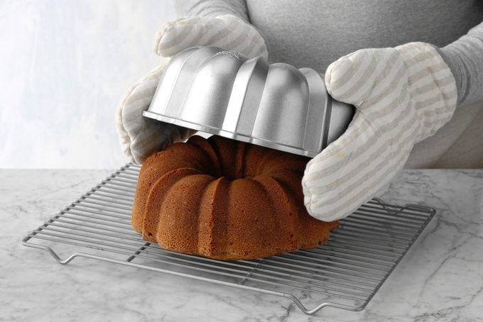 Lemon Bundt cake baked coming out of the pan