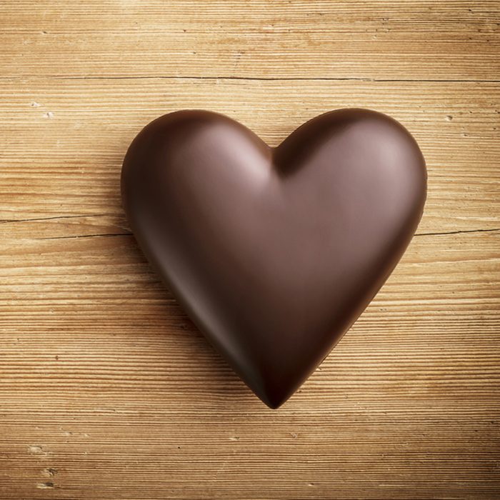 Chocolate heart on wooden background