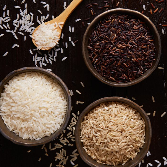 Jasmine rice, Brown rice, Red rice,Black rice, Mixed rice and Riceberry on rustic table