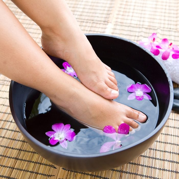 Feminine feet in oriental foot bath