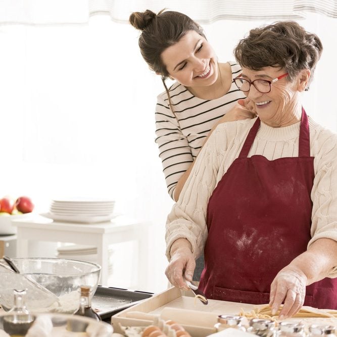 Granddaughter cooking with her happy grandma, having fun together; Shutterstock ID 661584427; Job (TFH, TOH, RD, BNB, CWM, CM): TOH Grandma's Meatball Secrets