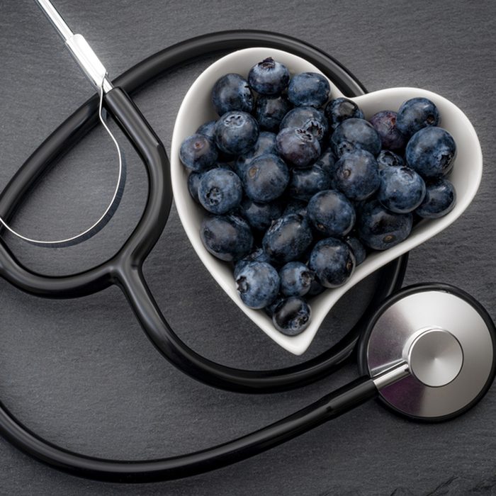 heart shaped bowl with blueberries and a stethoscope