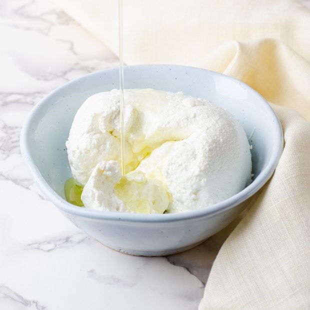 laban or labneh - homemade yogurt cheese with olive oil on marble texture background. Selective focus; Shutterstock ID 407812282; Job (TFH, TOH, RD, BNB, CWM, CM): TOH How to Make Labneh
