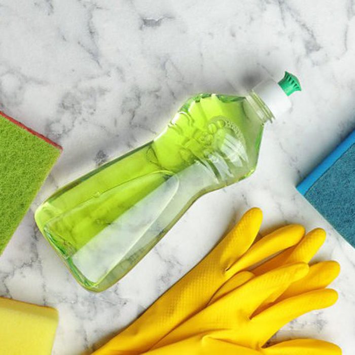 Cleaning supplies on marble countertop