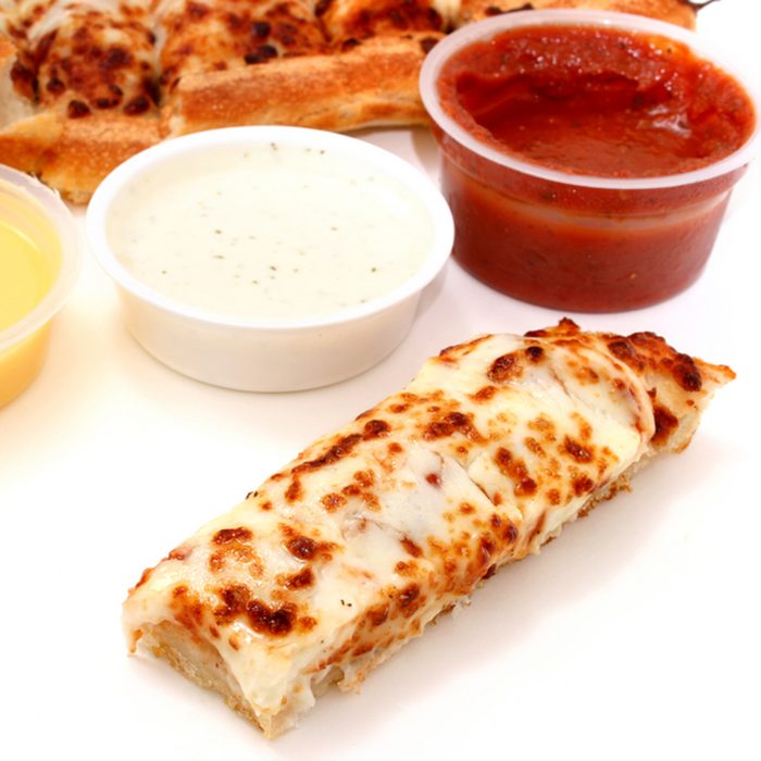 Take cheese pizza sticks with a container of marinara sauce, ranch dressing and garlic butter.