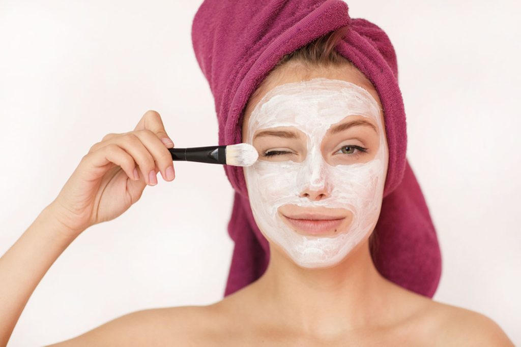 Woman with a yogurt face mask