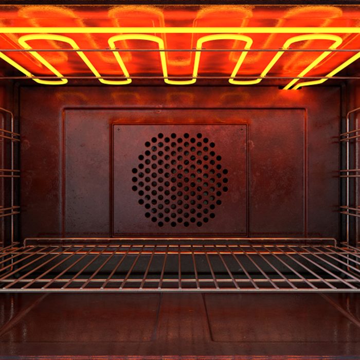 An upclose view through the front of the inside of an empty hot operational household oven with a glowing element and metal rack - 3D render; Shutterstock ID 1061325998; Job (TFH, TOH, RD, BNB, CWM, CM): TOH