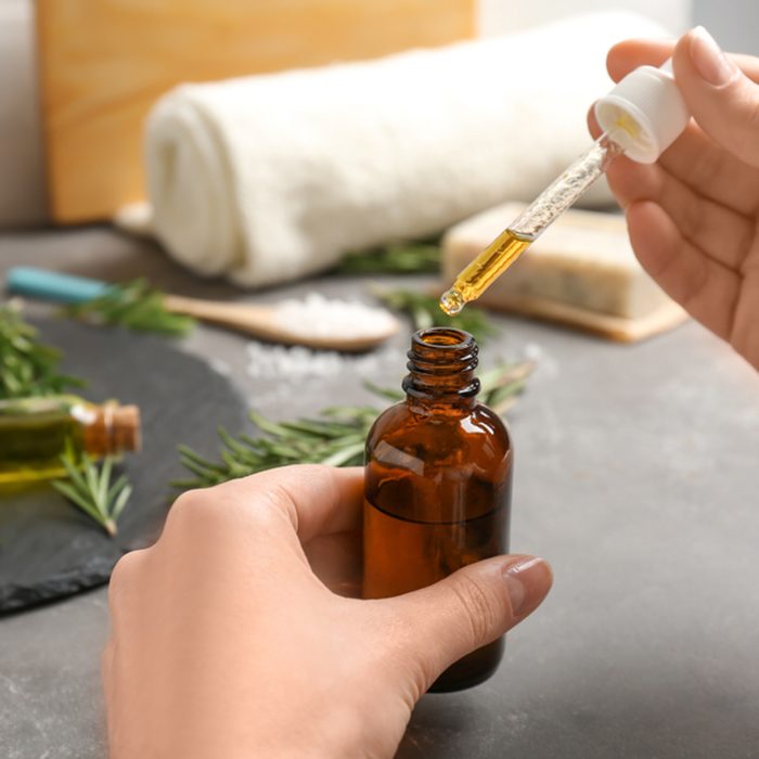 Woman with bottle of essential oil, closeup; Shutterstock ID 1068022715; Job (TFH, TOH, RD, BNB, CWM, CM): TOH