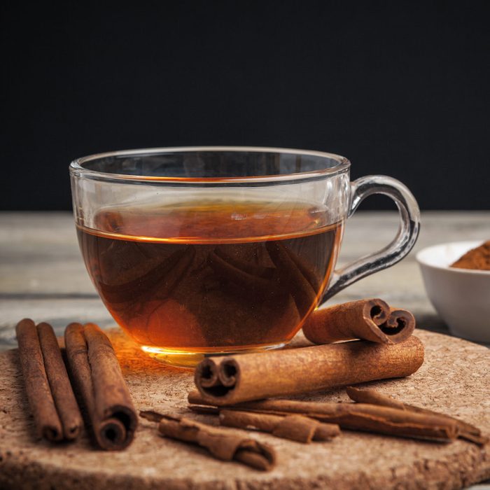 aromatic hot cinnamon tea on wooden table