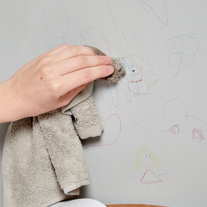 Cleaning crayon on the wall