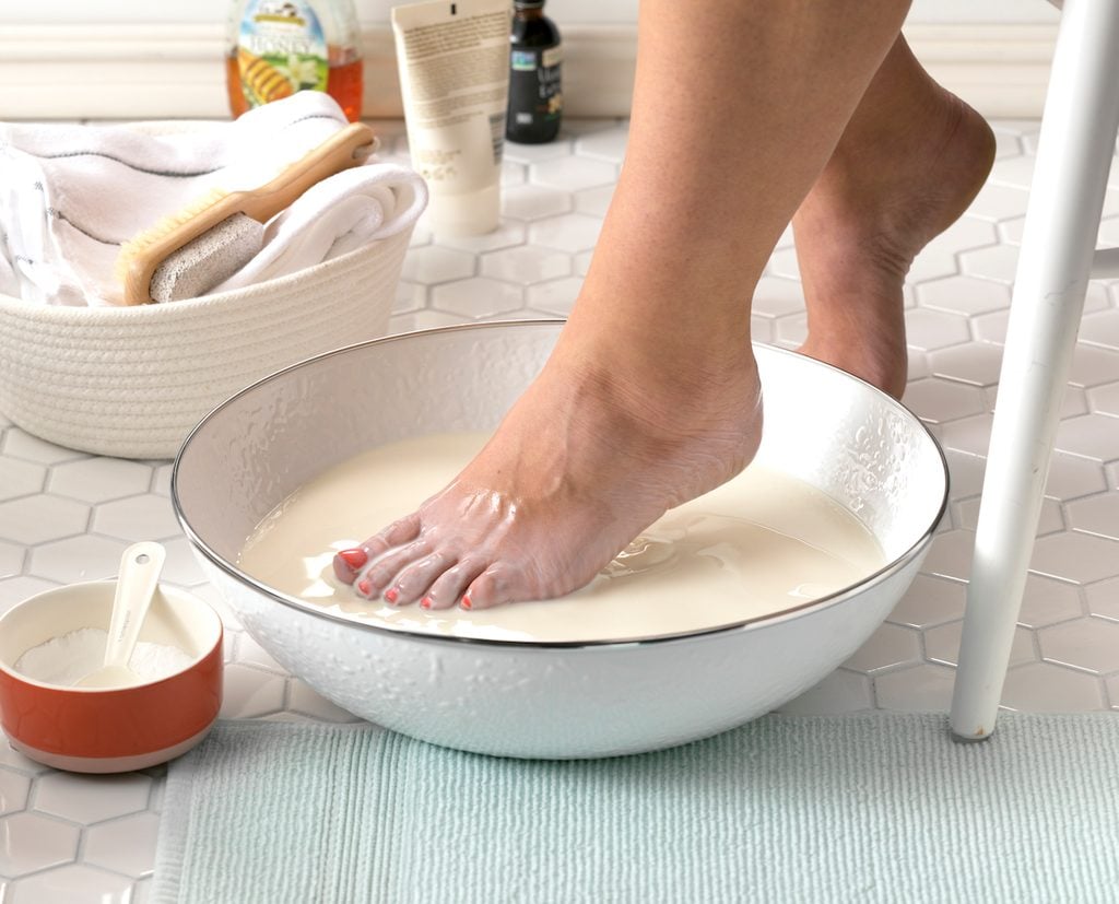 Stepping a foot into a soothing milk bath.