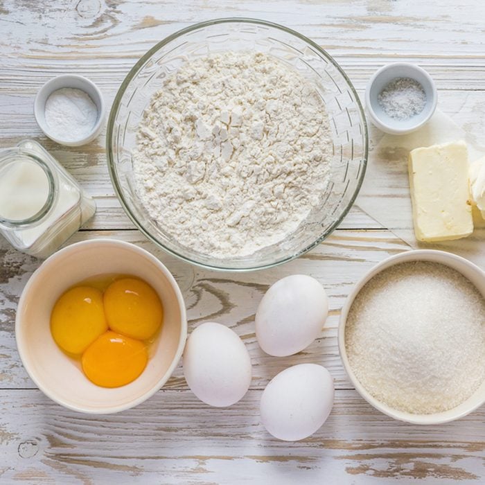 Ingredients for baking muffins on white wooden table, close-up; Shutterstock ID 420734245; Job (TFH, TOH, RD, BNB, CWM, CM): TOH