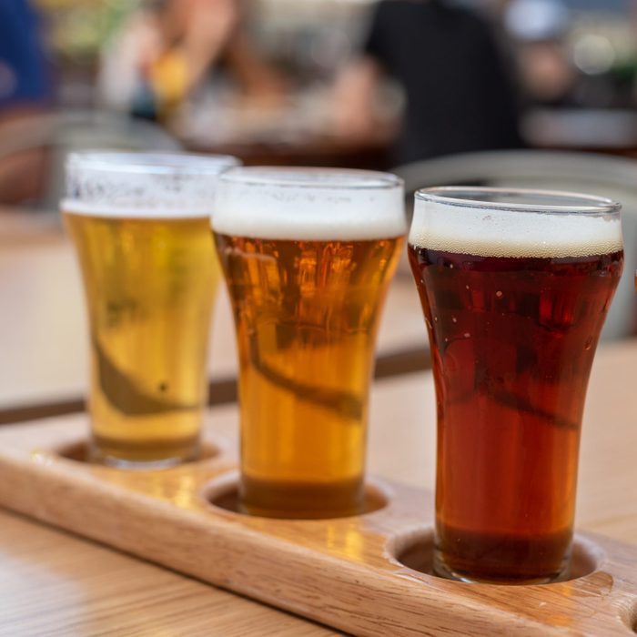 Closeup Of A Flight Of Cold Beer On A Restaurant Table