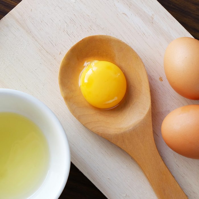 separated egg white and yolk; Shutterstock ID 363403886