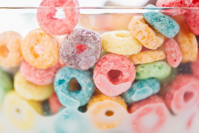 close up of a colorful bowl of cereal frozen in milk for april fools day