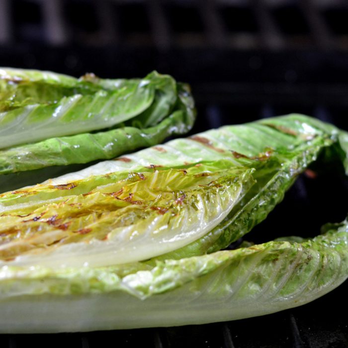 Grilled Romaine Lettuce Halves on the Barbecue.