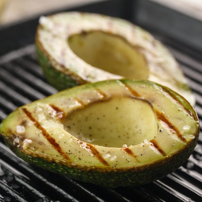 sliced fresh avocado on the grill.