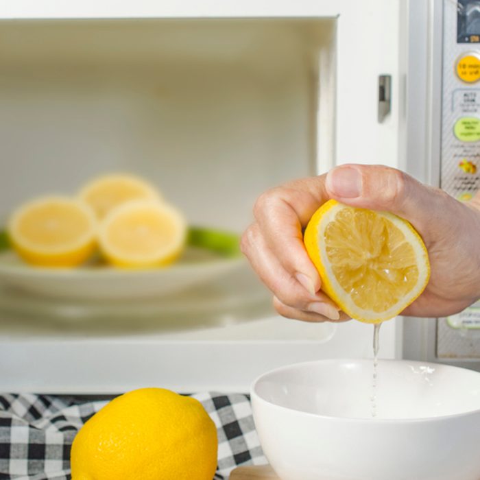microwaving lemons for 20 - 30 seconds before squeeze make them soft and easily squeeze; kitchen tips; Shutterstock ID 1144612682