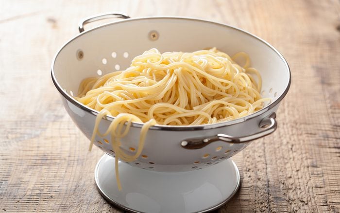spaghetti in colander