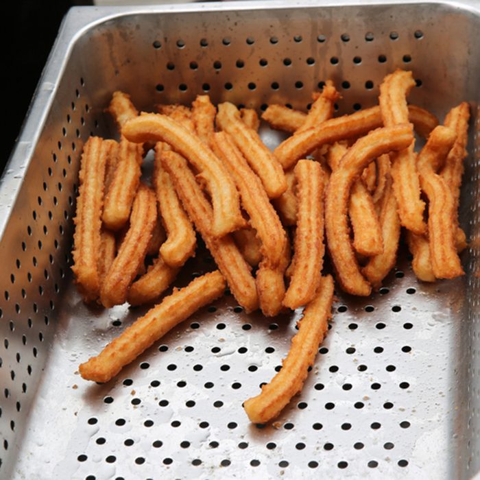 Churros. Deep Fried Bread Dough in Hot Boiling Oil with Cinnamon and sugar. ; Shutterstock ID 1173562132; Job (TFH, TOH, RD, BNB, CWM, CM): TOH