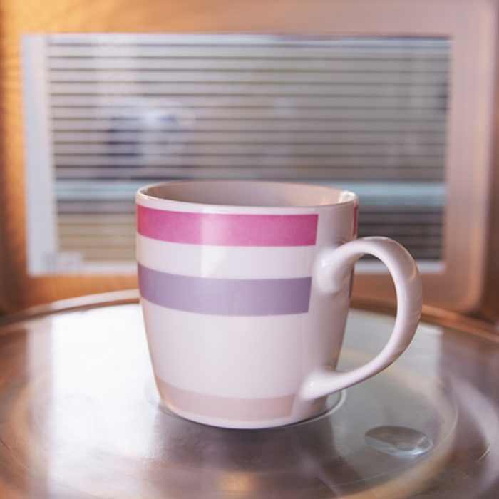 Warming Cup Of Coffee Inside Microwave Oven; Shutterstock ID 234672856; Job (TFH, TOH, RD, BNB, CWM, CM): TOH