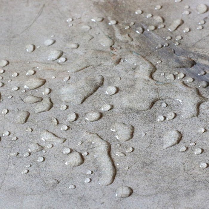 shutterstock_497084359 concrete countertop with water spill