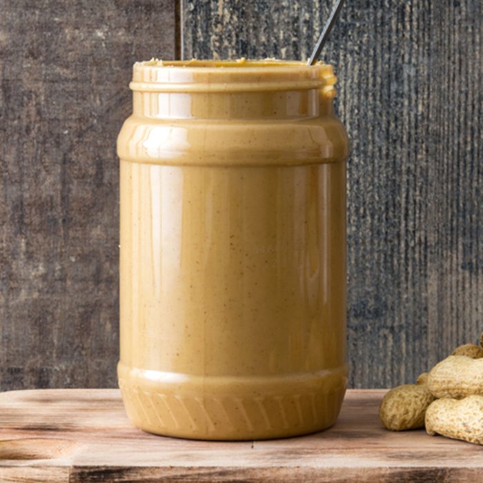 Peanut butter jar on wooden table. Copyspace. ; Shutterstock ID 553058383