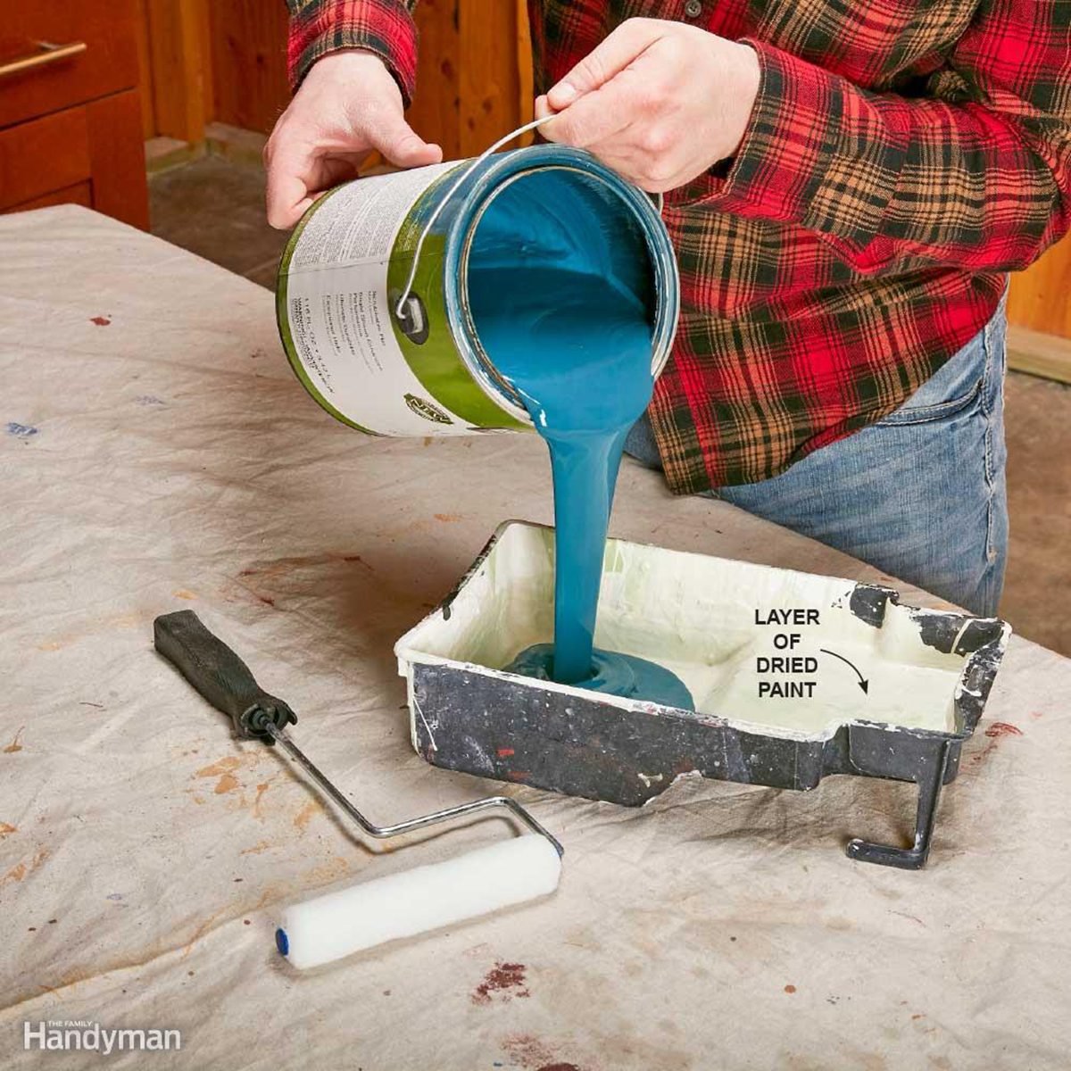 Pouring paint into a tray