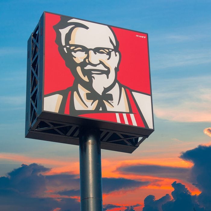 KFC logo against a sunset