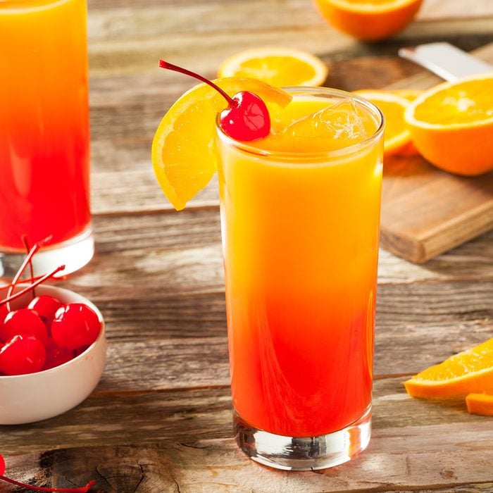 Juicy Orange and Red Tequila Sunrise with a Cherry