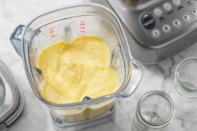 Mango Smoothies Showing ingredients blended inside blender